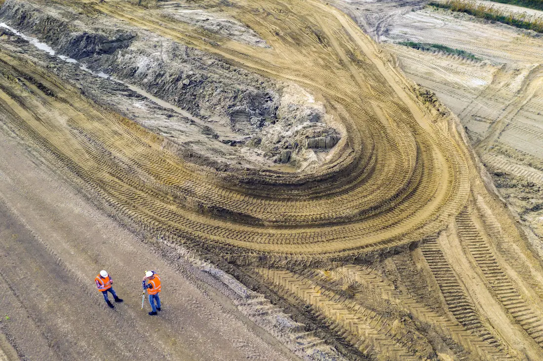 Geodesists checking survey data on site